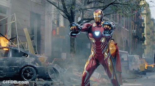 Man In Iron Man Suit Standing In City GIF