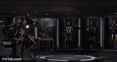 Man In Iron Man Suit With Other Iron Man Suits GIF