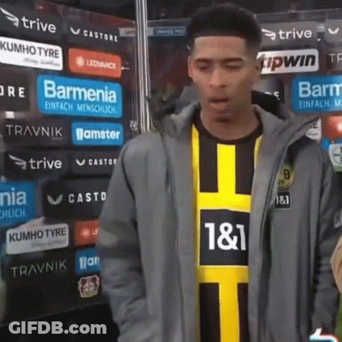Man In Jacket And Yellow Black Shirt Number 11 GIF