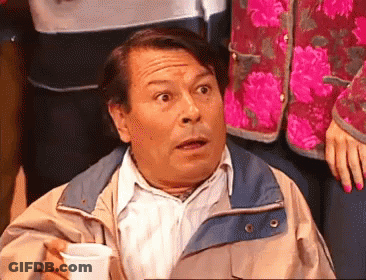 Man In Jacket Holding Cup Making Funny Face GIF