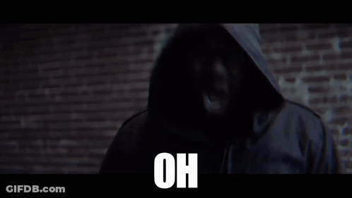 Man In Jacket In Front Of Brick Wall Saying Oh GIF
