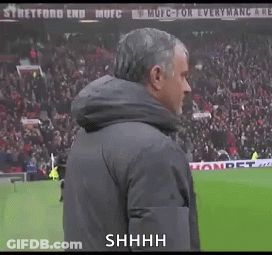 Man In Jacket On Soccer Field Saying Shhhh GIF
