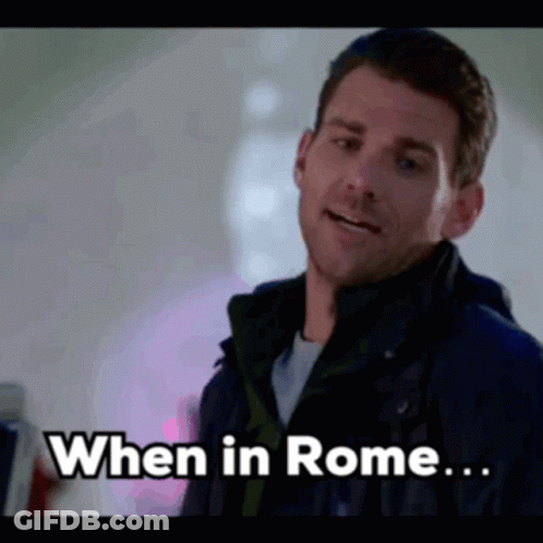 Man In Jacket Saying When In Rome GIF