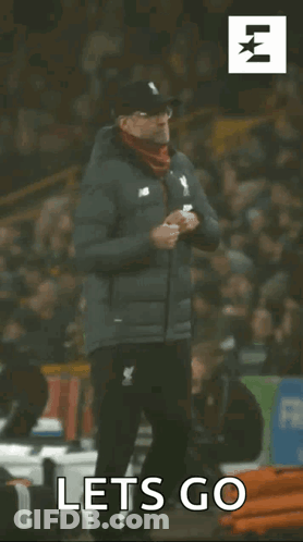 Man In Jacket Says Let's Go To Crowd GIF