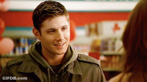 Man In Jacket Smiling Talking To Woman GIF