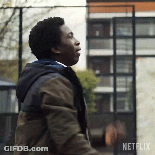 Man In Jacket Standing In Front Of Basketball Hoop GIF