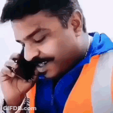 Man In Jacket Standing On Soccer Field GIF