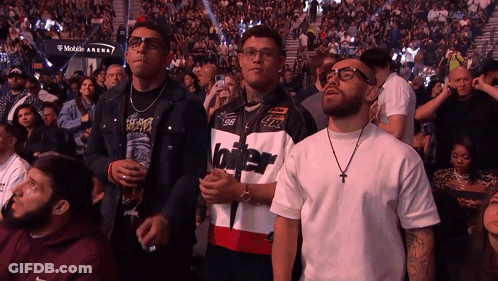 Man In Jacket With Number 96 In Front Of Crowd GIF
