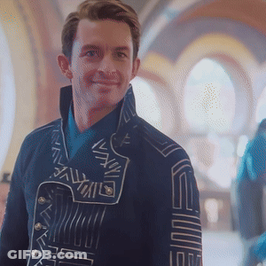 Man In Jacket With S On Sleeve GIF