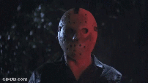 Man In Jason Voorhees Mask In Dark Rain GIF