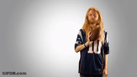 Man In Jersey Number 10 Holding Football GIF