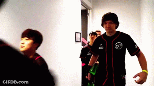 Man In Jersey Number 100 Walking Down Hallway GIF