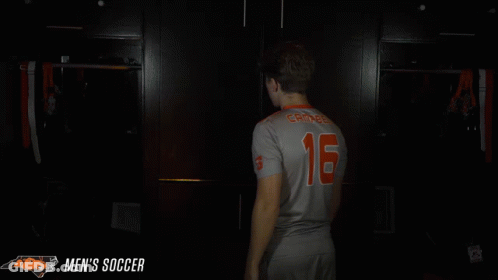 Man In Jersey Number 16 Praying In Dark Room GIF