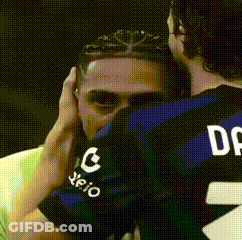 Man In Jersey Number 2 Hugging Another Man GIF