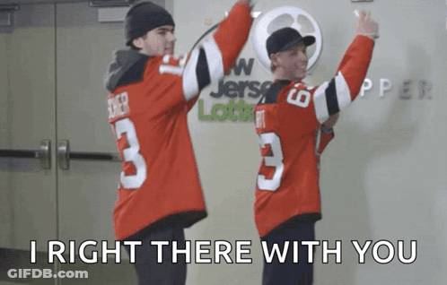 Man In Jersey Number 3 Standing Next To Another Man GIF