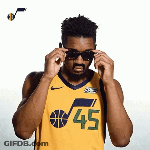 Man In Jersey Number 45 Adjusting Sunglasses GIF
