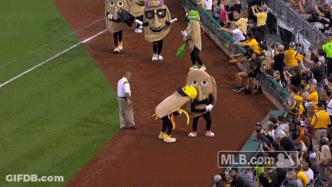Man In Jersey Number 69 Next To Mascot GIF