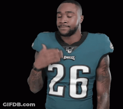 Man In Jersey Number 9 Jumping On Couch GIF