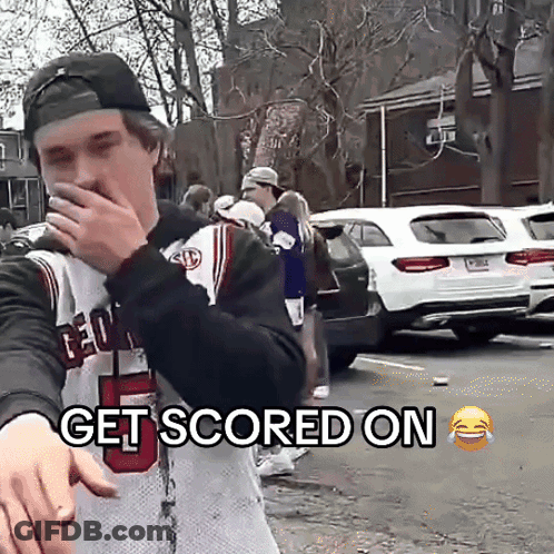 Man In Jersey Saying Get Scored On Covering Mouth GIF