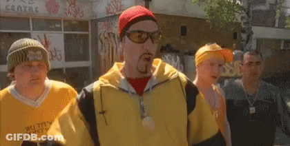 Man In Jersey Saying The Rock Talking To Another Man GIF