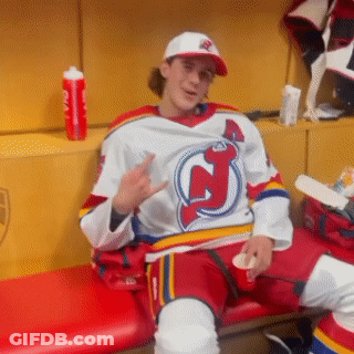 Man In Jersey With Letter J Sitting On Bench GIF