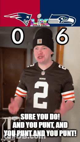 Man In Jersey With Number 2 In Front Of Patriots And Seahawks Banner GIF