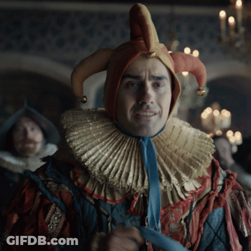 Man In Jester Costume With Blue Tie GIF