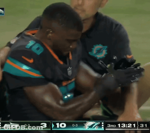 Man In Jets Jersey Helped Off Field GIF