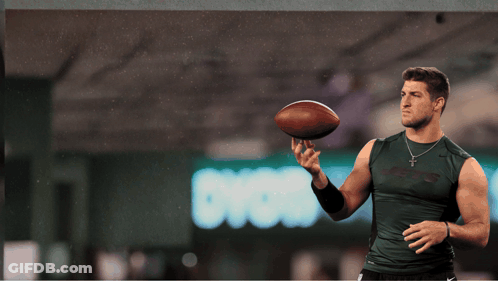 Man In Jets Shirt Holding Football GIF
