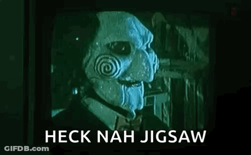 Man In Jigsaw Mask In Front Of TV Saying Heck Nah Jigsaw GIF