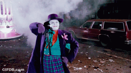 Man In Joker Costume Standing In Front Of Car GIF