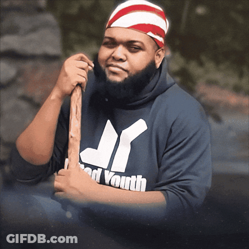 Man In Jr Brand Youth Sweatshirt Holding Stick GIF
