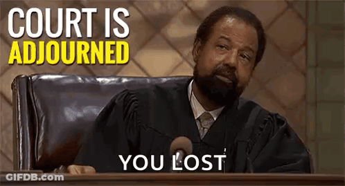 Man In Judge Robe Sitting At Podium In Courtroom GIF