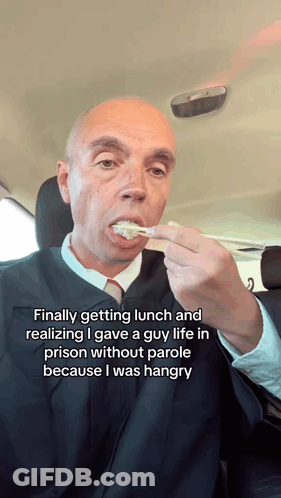 Man In Judge's Robe Eating Food GIF