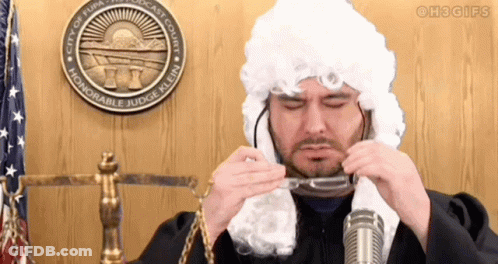 Man In Judge Wig Holding Glasses GIF