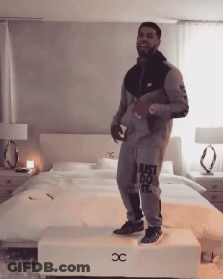 Man In Just Do It Outfit Standing On Stool GIF
