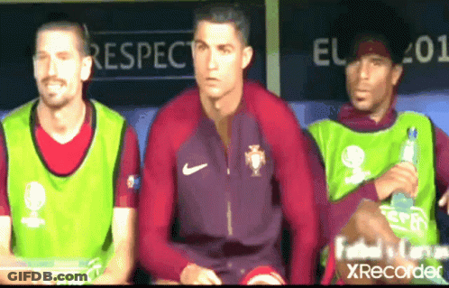 Man In Kafd Shirt In Front Of Men GIF