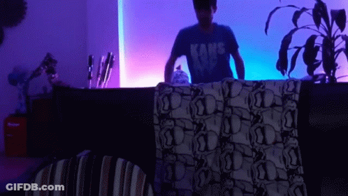 Man In Kane Shirt By Purple Light GIF