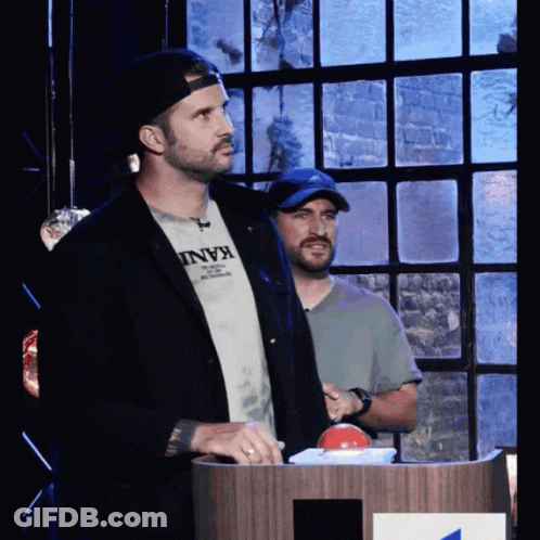 Man In Kani T-Shirt At Podium GIF