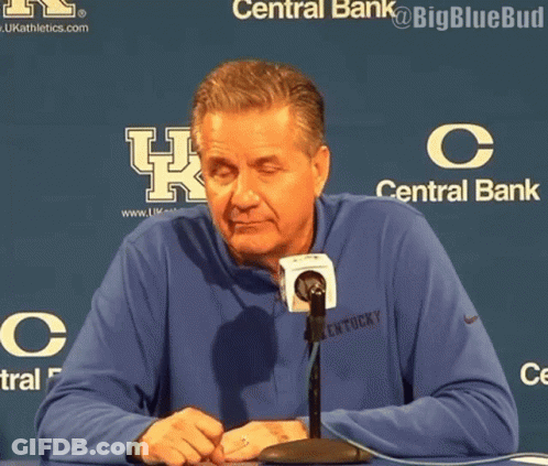 Man In Kentucky Shirt Sitting At Table With Microphone GIF