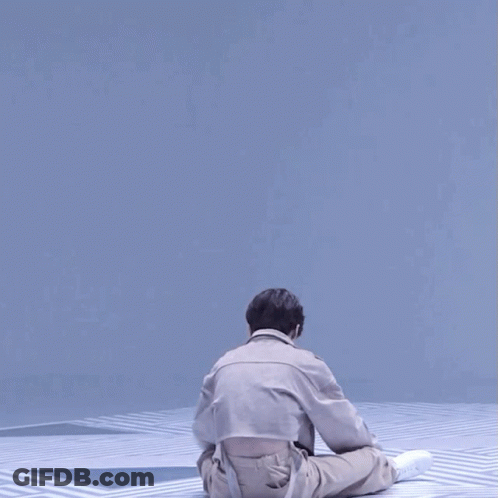 Man In Khaki Pants And Tan Jacket Dancing GIF