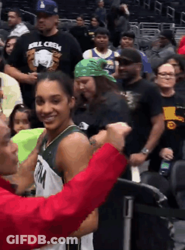 Man In Kill Crew Shirt Talking To Girl In Basketball Uniform GIF