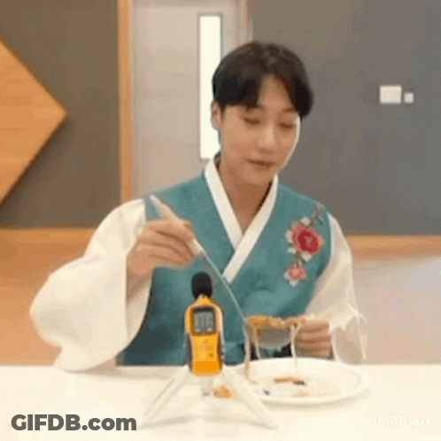 Man In Kimono With Plate Of Food GIF