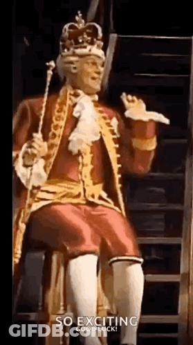 Man In King Costume Sitting On Chair With Crown GIF