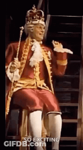Man In King Costume Sitting On Staircase Holding Cane GIF