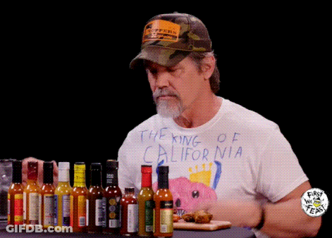 Man In King Of California T-Shirt Holding Hot Sauce GIF