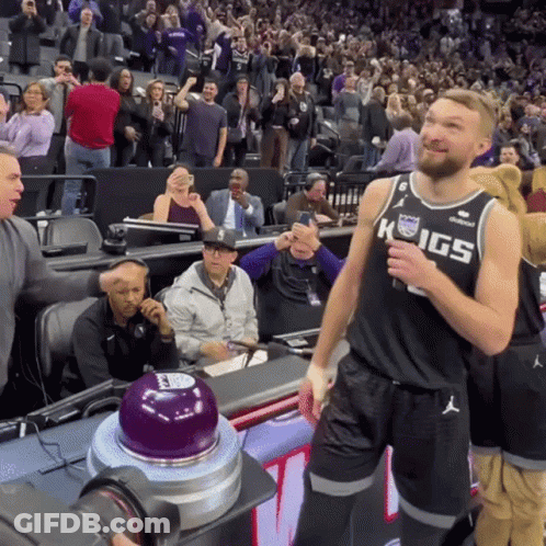 Man In Kings Jersey Standing In Front Of Crowd GIF