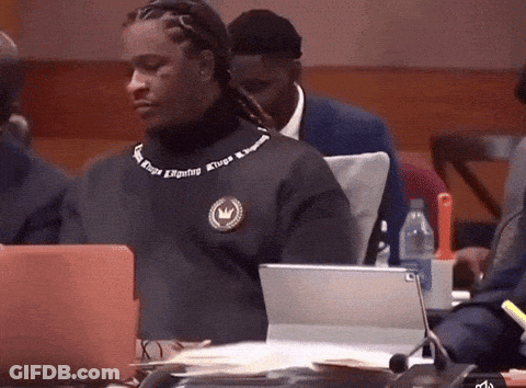 Man In Kings Reigning Sweater Sitting At Laptop GIF