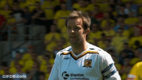Man In Kingston Communications Jersey On Soccer Field GIF