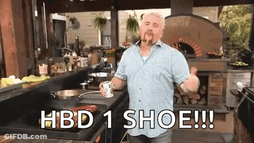 Man In Kitchen Holding Mug Saying HBD 1 Shoe GIF